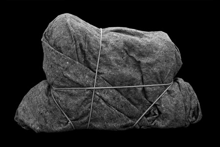 Henrik Olesen. Imitation/Enigma (2). 2008. Box, adhesive tape, rope, padding material, and blanket, 23 5/8 x 39 3/8 x 11 13/16" (60 x 100 x 30 cm). © Henrik Olesen. Courtesy the artist and Galerie Daniel Buchholz, Cologne and Berlin