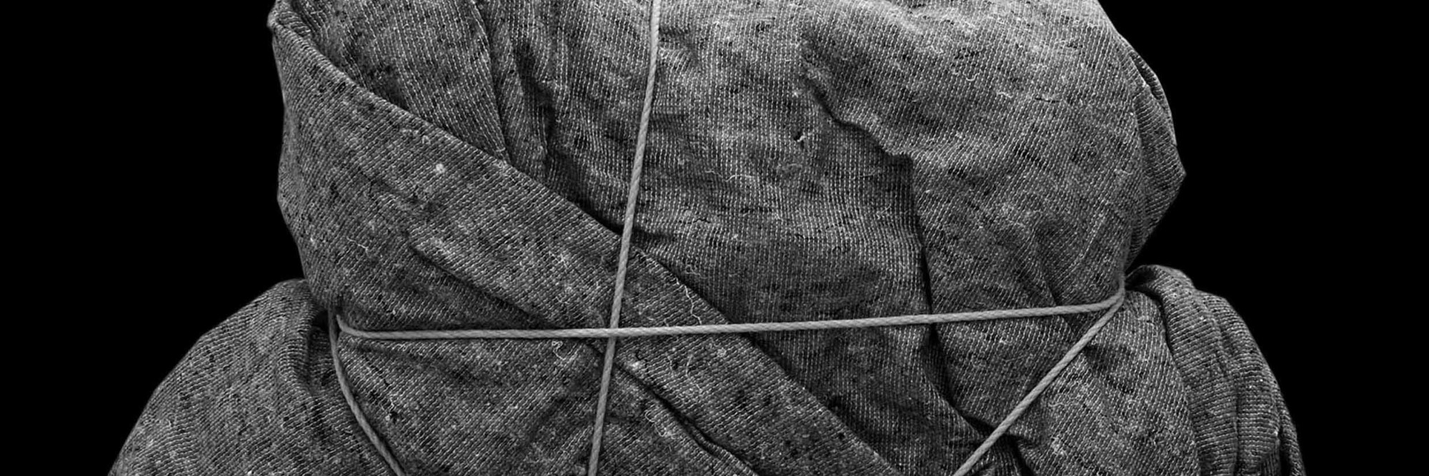 Henrik Olesen. Imitation/Enigma (2). 2008. Box, adhesive tape, rope, padding material, and blanket, 23 5/8 x 39 3/8 x 11 13/16" (60 x 100 x 30 cm). © Henrik Olesen. Courtesy the artist and Galerie Daniel Buchholz, Cologne and Berlin