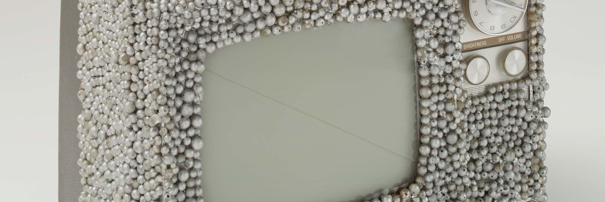 Nam June Paik and Otto Piene. Untitled. 1968. Manipulated television set and plastic pearls, 9 × 13 × 10″ (22.9 × 33 × 25.4 cm). Gift of The Junior Associates of The Museum of Modern Art, New York, The Greenwich Collection Ltd. Fund, and gift of Margot Ernst. © 2003 The Museum of Modern Art. Photo: Thomas Griesel