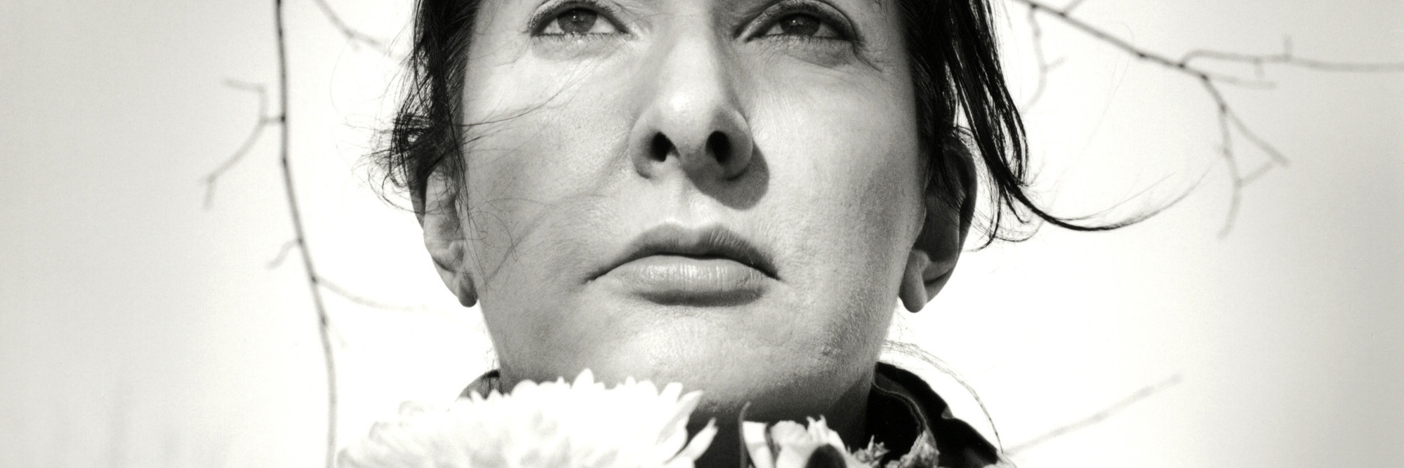 Marina Abramović. Portrait with Flowers. 2009. Black-and-white gelatin silver print; photo: Marco Anelli. © 2010 Marina Abramović. Courtesy the artist and Sean Kelly Gallery/Artists Rights Society (ARS), New York