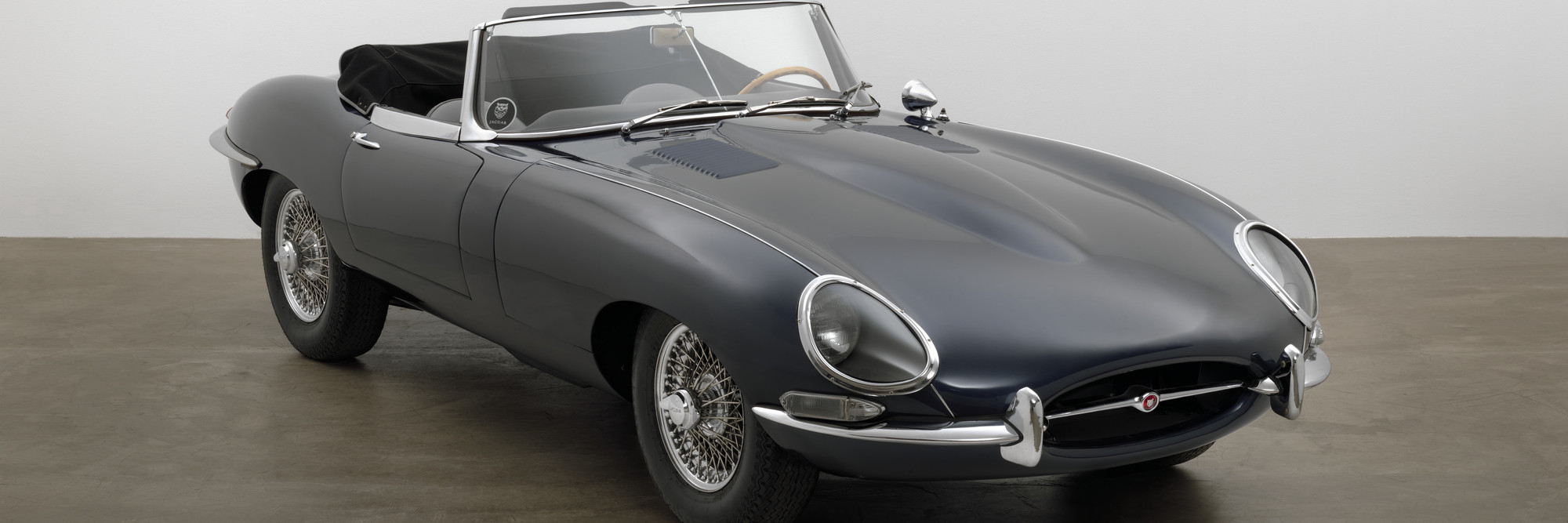 Sir William Lyons, Malcolm Sayer, William M. Heynes. E-Type Roadster. 1963. Steel unibody construction, 48 × 66 × 176″ (121.9 × 167.6 × 447 cm). Manufacturer: Jaguar Cars Ltd., England. Gift of Jaguar Cars. Photo: Jonathan Muzikar. © 1997 The Museum of Modern Art, New York