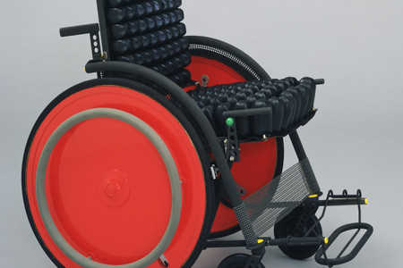 Kazuo Kawasaki. Carna Folding Wheelchair. 1989. Manufacturer: SIG Workshop Co. Ltd., Ishikawa, Japan. Titanium, rubber, and aluminum honeycomb, 33 × 22 × 35 1/4″ (83.8 × 55.9 × 89.5 cm). Gift of the designer