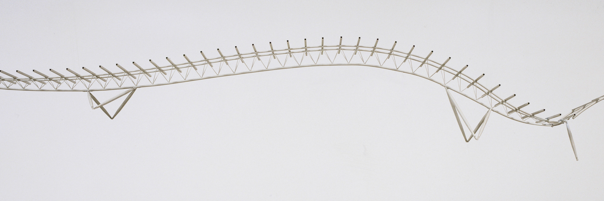 Renzo Piano Building Workshop, Renzo Piano, Noriaki Okabe, associate architect in charge with Peter Rice (Ove Arup and Partners), Nikken Sekkei Ltd. Kansai International Airport, Passenger Terminal Main Building, Osaka, Japan, Study model of main structural truss. 1988–94. Collaborating Artist: Peter Rice (Ove Arup and Partners), Nikken Sekkei Ltd. Painted brass, 5 1/8 × 51 7/8 × 6 7/8″ (13 × 131.8 × 17.5 cm). Gift of the architect in honor of Philip Johnson. © 2016 Renzo Piano