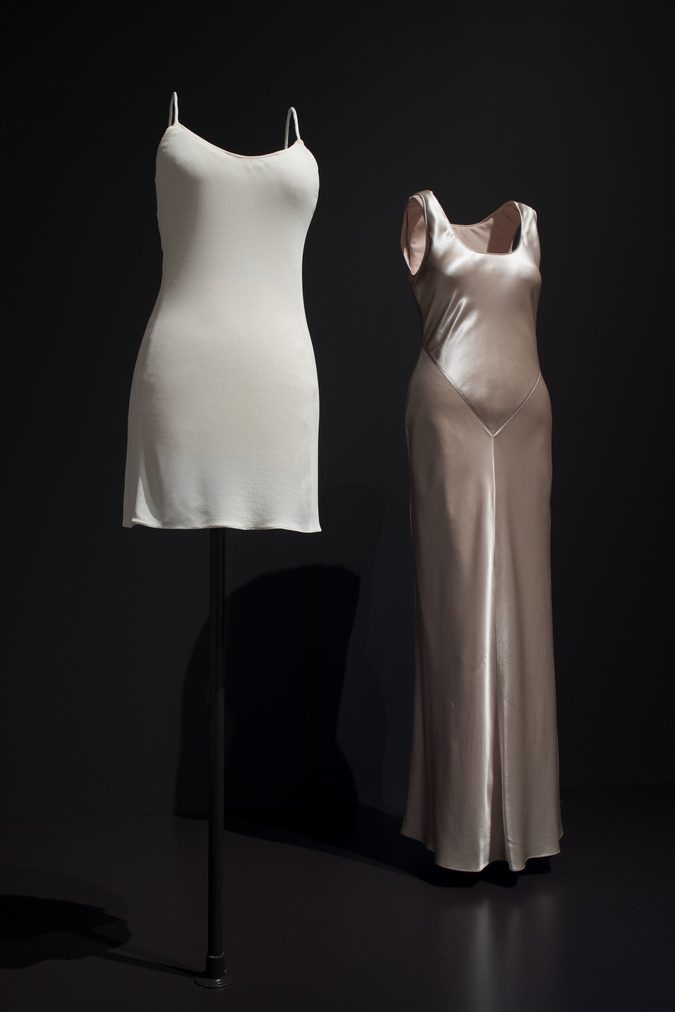 Calvin Klein (American, born 1942). Calvin Klein (United States, founded 1968). Dress, 1994. Silk matte jersey. Dress, 1995. Hammered silk satin. PVH Corp./Calvin Klein Inc. Archives. Image taken during installation of _Items: Is Fashion Modern?_ 
