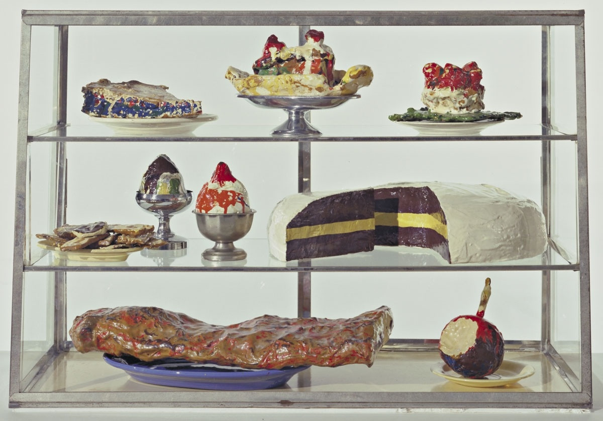 Pastry Case, I
Date: 1961-62
Medium: Burlap and muslin soaked in plaster, painted with enamel, metal bowls, and ceramic plates in glass-and-metal case
Dimensions: 20 3/4 x 30 1/8 x 14 3/4" (52.7 x 76.5 x 37.3 cm)
Credit Line: The Sidney and Harriet Janis Collection
MoMA Number: 639.1967.a-dd
