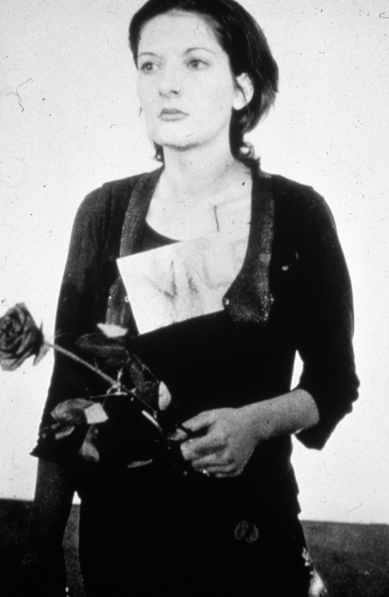 Marina Abramović. _Rhythm 0._ Performed in 1974 for 6 hours at Studio Morra, Naples  
 Still from 35mm slide projection (black and white and color, silent) with 72 objects. Duration variable © 2010 Marina Abramović. Courtesy the artist and Sean Kelly Gallery/Artists Rights Society (ARS), New York