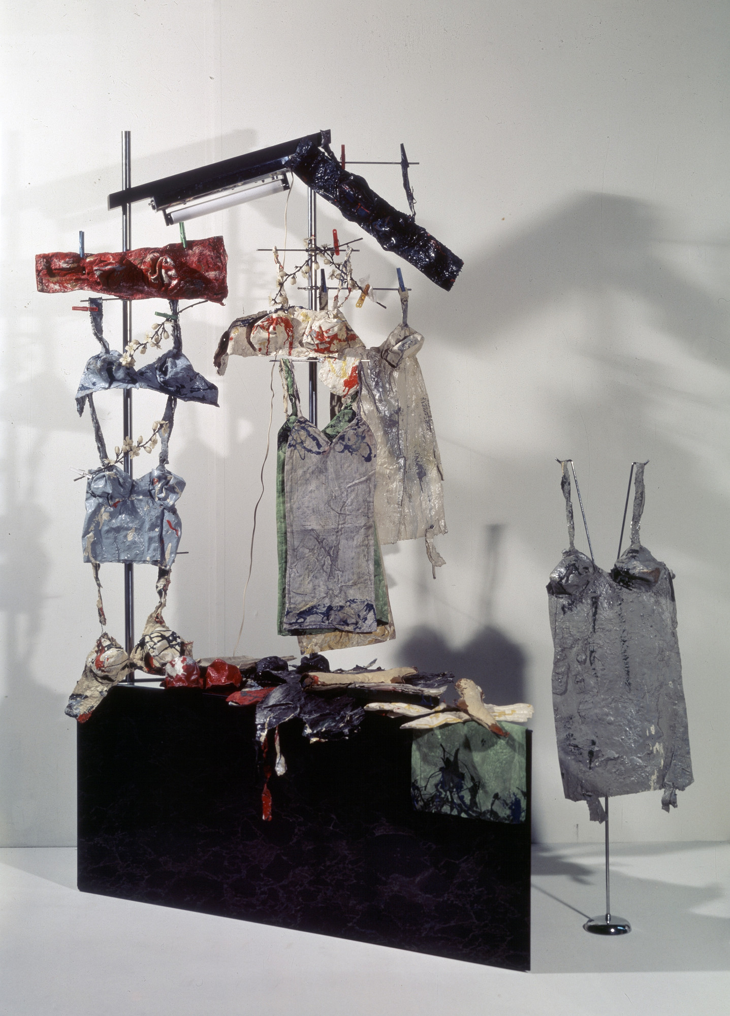 Lingerie Counter
Date: 1962
Medium: Textiles, canvas, plaster, enamel, metal stand, neon tube, mirror, and fiberboard
Dimensions: 7' 1 13/16" x 63 3/4" x 50" (218 x 162 x 127 cm)
Credit Line: Ludwig Museum - Museum of Contemporary Art, Budapest
