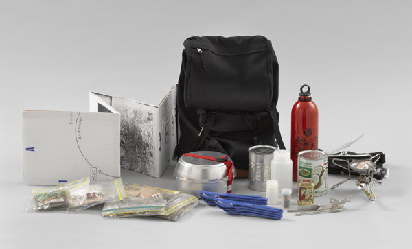 Rirkrit Tiravanija. _Untitled (Rucksack Installation)_. 1993. Multiple of backpack, map, camping stove, dishes, can opener, and ingredients for a Thai rice meal rucksack (approx.): 15 3/4 x 12 5/8 x 11 7/16" (40 x 32 x 29cm); sheet (map): 76 5/16 x 68 1/8" (193.9 x 173 cm). The Museum of Modern Art. Purchased with funds given by Linda Barth Goldstein.