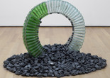 David Hammons. Untitled (Night Train). 1989. Glass bottles, caps, silicone glue, and coal, dimensions variable, approximately 30 x 42 x 42" (76.2 x 106.7 x 106.7 cm). Gift of the Hudgins Family in memory of Lawrence D. “Butch” Morris