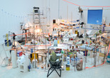 Sarah Sze. Triple Point (Pendulum). 2013. Salt, water, stone, string, projector, video, pendulum, and other materials, dimensions variable, approximately 150 × 210 × 200" (381 × 533.4 × 508 cm). Gift of the International Council of The Museum of Modern Art, Agnes Gund, Ronald S. and Jo Carole Lauder, and Sharon Percy Rockefeller, in honor of the 60th Anniversary of the International Council
