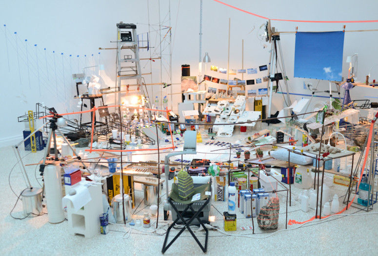 Sarah Sze. Triple Point (Pendulum). 2013. Salt, water, stone, string, projector, video, pendulum, and other materials, dimensions variable, approximately 150 × 210 × 200" (381 × 533.4 × 508 cm). Gift of the International Council of The Museum of Modern Art, Agnes Gund, Ronald S. and Jo Carole Lauder, and Sharon Percy Rockefeller, in honor of the 60th Anniversary of the International Council