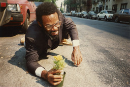 Pope.L (American, born 1955). How Much Is That Nigger in the Window a.k.a. Tompkins Square Crawl, Tompkins Square Park, New York. 1991. Inkjet print, 10 × 15" (25.4 × 38.1 cm). The Museum of Modern Art, New York. Acquired in part through the generosity of Jill and Peter Kraus, Anne and Joel S. Ehrenkranz, The Contemporary Arts Council of The Museum of Modern Art, The Jill and Peter Kraus Media and Performance Acquisition Fund, and Jill and Peter Kraus in honor of Michael Lynne. © Pope.L, courtesy the artist