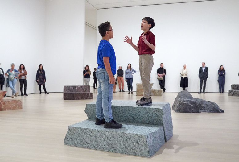 Jennifer Allora (American, born 1974). Guillermo Calzadilla (Cuban, born 1971). Fault Lines. 2013. Ten metamorphic and igneous rocks, live performance by two boy soprano singers. Music: Guarionex Morales-Matos (Puerto Rican, born 1968). Libretto: Allora &amp; Calzadilla. The Museum of Modern Art, New York. Gift of Bob Rennie, 2016. © 2019 Jennifer Allora and Guillermo Calzadilla. Installation view, October 21, 2019-January 4, 2020, The Museum of Modern Art, New York. Image © 2019 The Museum of Modern Art. Photo: Heidi Bohnenkamp