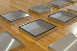 Donald Judd. Untitled.1976-1977. Stainless steel. 21 units, each 4 × 27 × 23" (10.2 × 68.6 × 58.4 cm), with 13.5" (34.3 cm) intervals. Overall: 4 × 108 × 230" (10.2 × 274.3 × 584.2 cm). Collection of the Des Moines Art Center. Purchased with funds from the