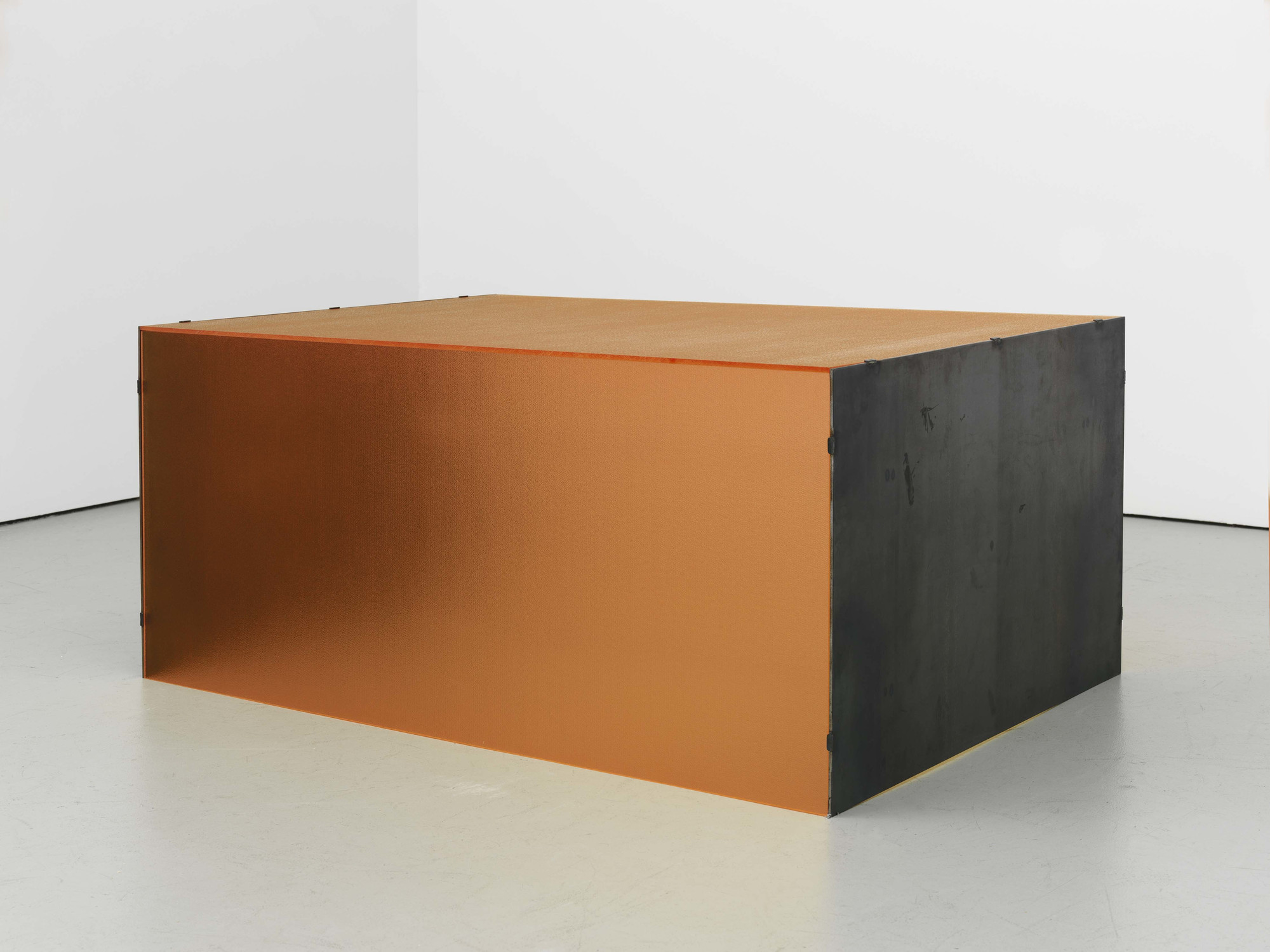 Donald Judd. _Untitled_. 1964. Orange pebbled Plexiglas and hot-rolled steel. 20 × 45 3/8 × 31" (50.8 × 115.3 × 78.7 cm). Stephen Flavin, Garrison. © 2020 Judd Foundation / Artists Rights Society (ARS), New York