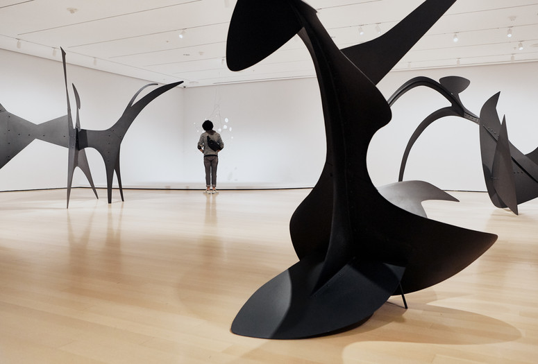 Installation view of Alexander Calder: Modern from the Start, March 14–August 7, 2021. All artworks by Alexander Calder. Collection of The Museum of Modern Art, New York. © 2021 Calder Foundation, New York/Artists Rights Society (ARS), New York. Shown (from left): Black Beast. 1940. Sheet metal, bolts, and paint. Calder Foundation, New York; Snow Flurry I. 1948. Sheet steel, steel wire, and paint. Gift of the artist; Devil Fish. 1937. Sheet metal, bolts, and paint. Calder Foundation, New York; Black Widow. 1959. Sheet steel and paint. Mrs. Simon Guggenheim Fund. Photo: Christiana Rifaat