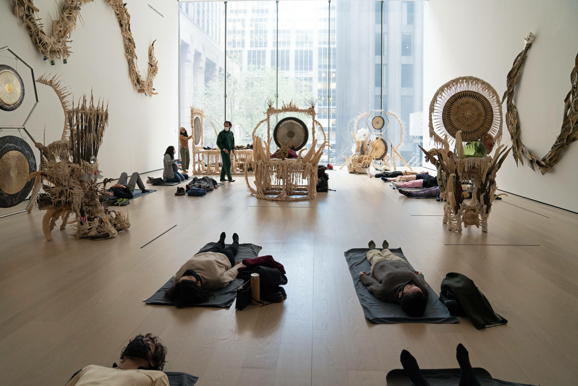 Guadalupe Maravilla: Luz y fuerza Healing Sound Baths, performed on November 3, 2021, as part of the gallery *Guadalupe Maravilla: Luz y Fuerza* in the exhibition *Collection 1970s–present*, October 30, 2021 - October 30, 2022. Performers: Guadalupe Maravilla, Hilary Ramos, and Sam Xu. Digital image © 2022 The Museum of Modern Art, New York. Photo: Julieta Cervantes