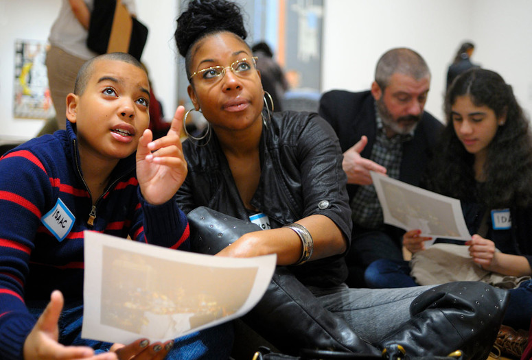 Family Programs. 2012. Digital Image © The Museum of Modern Art, New York. New York Photo: Martin Seck Image description: Families comparing a handout to a work of art during a Family Gallery Talk. Photo: Martin Seck
