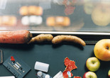 Wolfgang Tillmans. still life, New York. 2001. Image courtesy of the artist, David Zwirner, New York/Hong Kong, Galerie Buchholz, Berlin/Cologne, Maureen Paley, London Image description: A horizontally oriented photograph shows a close-up view of a window sill. A carrot, fingerling potatoes, apples, vegetable peels, a cassette tape, and an empty film canister are scattered near the windowpane, with a blurry view of a city street below.