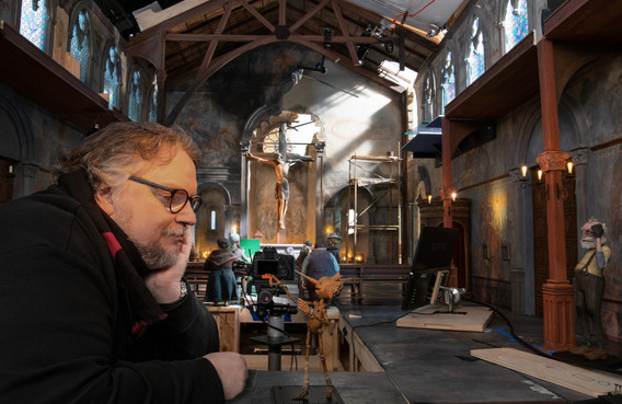 Guillermo del Toro on the set of Guillermo del Toro's Pinocchio, 2022. Image courtesy Jason Schmidt/Netflix