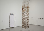 Installation view of Nari Ward's Vertical Hold. 1996. Yarn and bottles, 107 × 30" (271.8 × 76.2 cm). The Museum of Modern Art, New York. Gift of the Hudgins Family in memory of J. I. Nelson and Sarita Nelson-Nunnelee Vertical Hold. 1996. Yarn and bottles, 107 × 30" (271.8 × 76.2 cm). The Museum of Modern Art, New York. Gift of the Hudgins Family in memory of J. I. Nelson and Sarita Nelson-Nunnelee