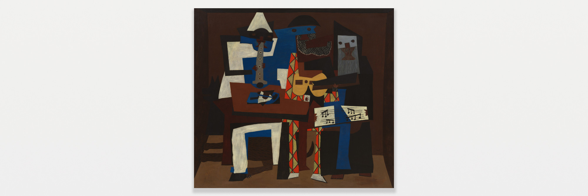 Pablo Picasso. Three Musicians. Fontainebleau, summer 1921. Oil on canvas, 6' 7" × 7' 3 3/4" (200.7 × 222.9 cm). Mrs. Simon Guggenheim Fund. © 2022 Estate of Pablo Picasso/Artists Rights Society (ARS), New York