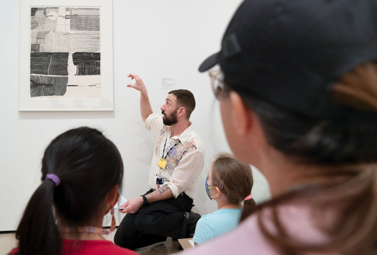 Photo: Family Gallery Talks, The Museum of Modern Art, New York, November 12, 2022. Digital Image © 2023 The Museum of Modern Art, New York. Photo: Martin Seck Image description: Participants learn about abstraction in a Family Gallery Talk