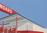 Ed Ruscha. Standard Station, Ten-Cent Western Being Torn in Half. 1964. Oil on canvas, 65 ×121 1/2" (165.1 × 308.6 cm). Private collection. © Edward Ruscha. Photo © Evie Marie Bishop, courtesy of the Modern Art Museum of Fort Worth Image description: A Pop art painting of a white gas station with a vibrant red sign that reads “STANDARD” in white lettering. A row of red gas pumps contrast against a solid bright blue sky. The gas station fills the left of the canvas at a diagonal from the top left corner to the bottom right, splitting the painting into two triangles. A small yellow comic book torn down the middle is painted in the top right corner.