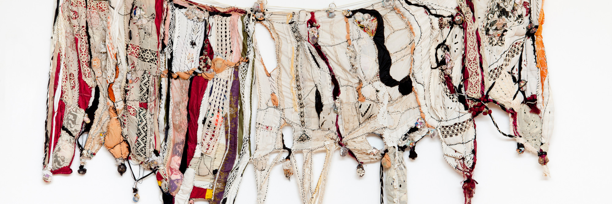 Sonia Gomes. Memory. 2004. Textile, plastic, glass, ceramic, and metal, 58 1/8" × 8' 10 1/4" (147.6 × 270 cm). The Museum of Modern Art, New York. Gift of Christie Zhou and purchase. ©️ 2023 Sonia Gomes. Courtesy of the artist