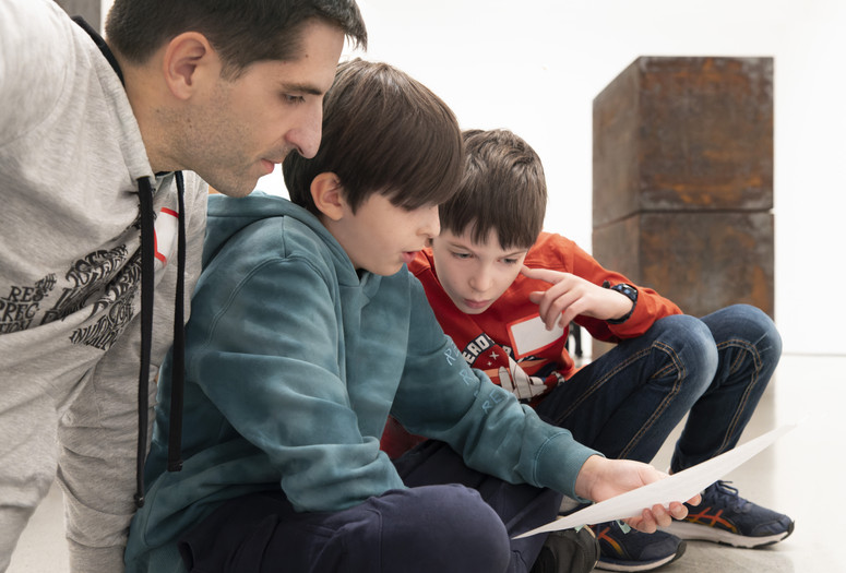 Photo: Martin Seck Image description: A family works on an activity together during a Family Gallery Talk.