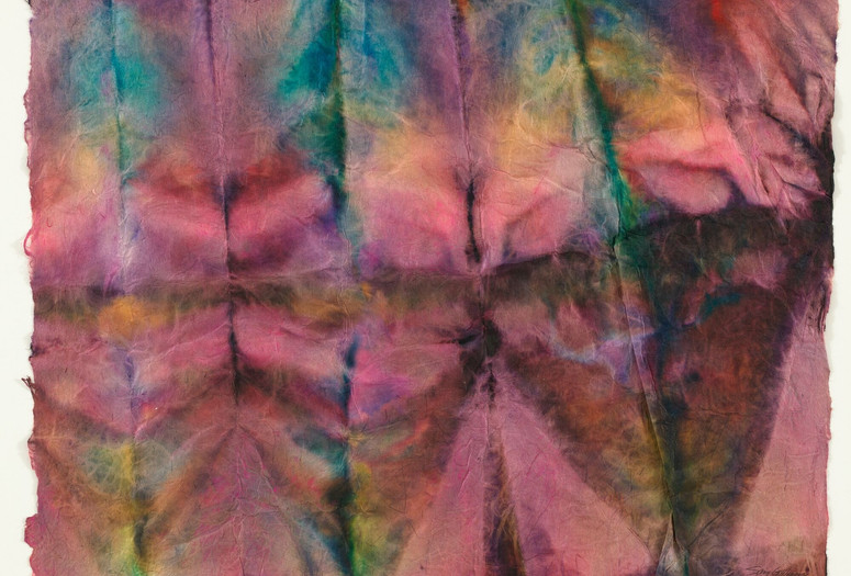 Sam Gilliam. Untitled. 1971. Dye stain on mulberry paper. The Museum of Modern Art, New York. Acquired with matching funds from The Lily Auchincloss Foundation, Inc. and the National Endowment for the Arts. © Sam Gilliam/Artists Rights Society (ARS), New York Image description: A piece of frayed, textured paper has been folded with deep vertical and horizontal creases. Deep magentas, blues, yellows, and amber watercolors bleed into one another in a tie-dye effect across the gridded folds.