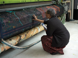 Otobong Nkanga with textile in progress for Otobong Nkanga: Cadence. Courtesy of the artist © Otobong Nkanga. Photo: Wim van Dongen