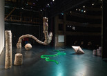 Installation view, Nour Mobarak: Dafne Phono. 2023. Pleurotus citrinopileatus and Trametes versicolor mycelium, wood, plaster, PET plastic, silicone, steel, vacuum, hole, 4 3/8 × 2 3/4" (11 × 7 cm); 15-channel sound, single-channel video, 21:44 min. Courtesy the artist and Sylvia Kouvali, London/Piraeus