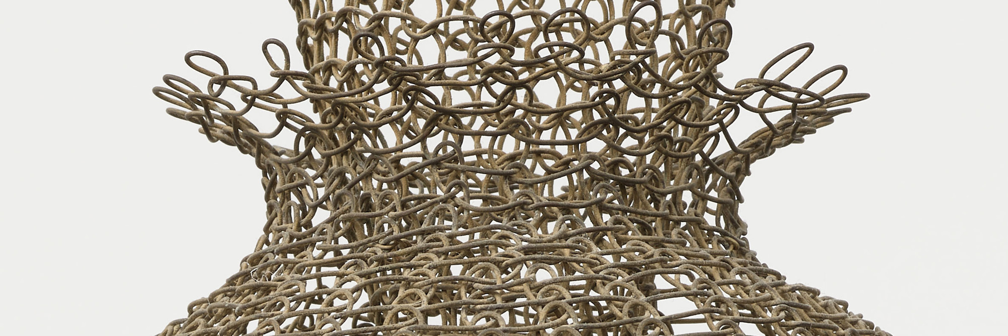 Ruth Asawa. Untitled (S.398, Hanging Eight-Lobed, Four-Part, Discontinuous Surface Form within a Form with Spheres in the Seventh and Eighth Lobes) (detail). c. 1955. Brass wire, iron wire, and galvanized iron wire, 8' 8 1/2" × 14 1/2 × 14 1/2" (265.4 × 36.8 × 36.8 cm). The Museum of Modern Art, New York. Promised gift of Alice and Tom Tisch, 2016. © 2024 Ruth Asawa Lanier, Inc./Artists Rights Society (ARS), New York. Courtesy David Zwirner
