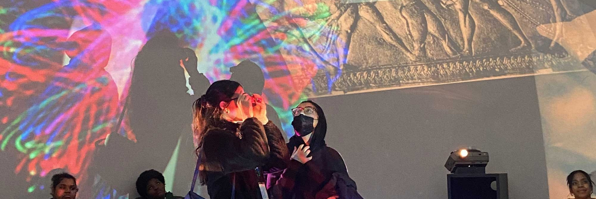 A group of teens explore Stan VanDerBeek’s Movie-Drome (1964–65), an artwork that includes colorful projections inside a dome. Photo: Amara Thomas