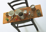 Daniel Spoerri. Kichka's Breakfast I. 1960. Wood chair hung on wall with board across seat, coffeepot, tumbler, china, eggcups, eggshells, cigarette butts, spoons, tin cans, and other materials. The Museum of Modern Art, New York. Philip Johnson Fund. © 2025 Daniel Spoerri/Artists Rights Society (ARS), New York/ProLitteris, Switzerland