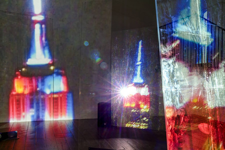 Lutz Bacher. Empire. 2014. High-definition video (color, sound; 10:43 min), two projectors, Plexiglas, sandbags, and metal stands. The Museum of Modern Art, New York. Acquired through the generosity of Lonti Ebers. © Lutz Bacher. Courtesy of the Estate of Lutz Bacher and Galerie Buchholz