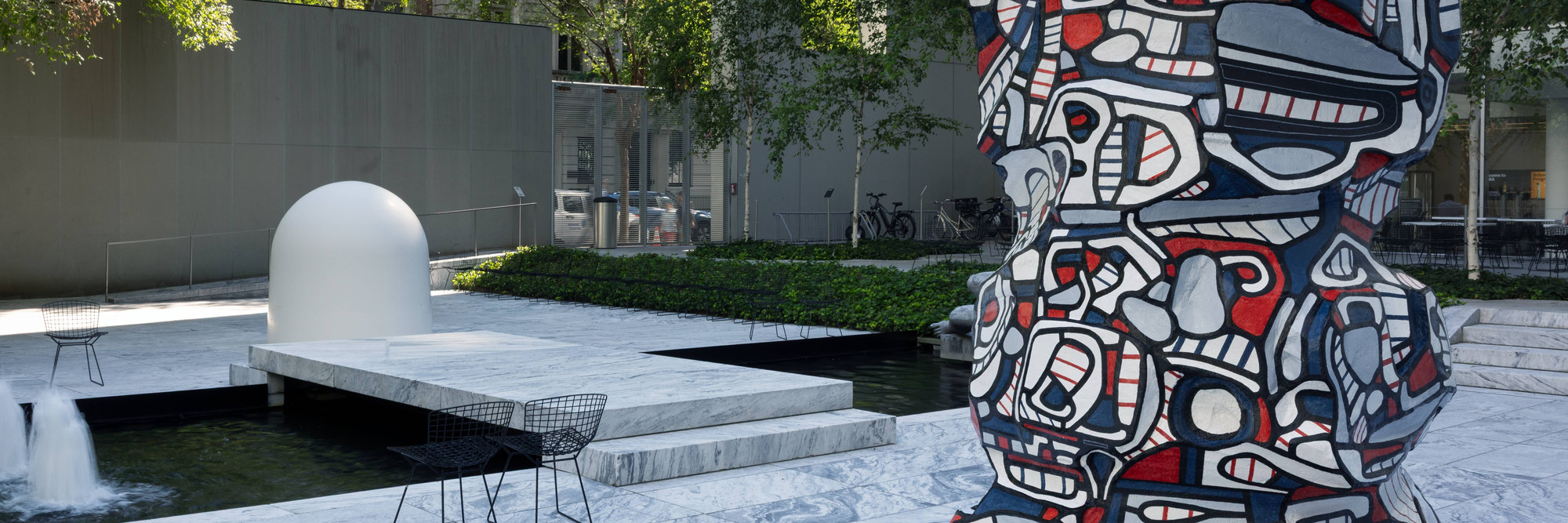 Installation view of the exhibition Oasis in the City, July 3, 2025 - May, 2026. The Museum of Modern Art, New York. Digital Image ©️ 2025 The Museum of Modern Art, New York. Photo by Jonathan Dorado. Shown: Jean Dubuffet. Study for Tower with Figures. 1968. Polyurethane paint on epoxy. Gift of Mr. and Mrs. M. Riklis. ©️ 2025 Artists Rights Society (ARS), New York / ADAGP, Paris; Robert Breer. Osaka I. 1970. Fiberglass shell, steel frame, battery-driven motor, and rubber-tire wheels. Gift of PepsiCo, Inc.