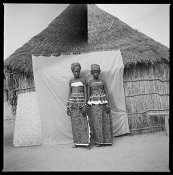 Untitled (Two Women with Thatched Roof House)