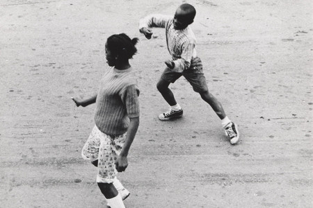 Joanne Leonard. Dancing Seen from Joanne’s Second Story, West Oakland, CA. c. 1967. Gelatin silver print, 5 1/16 × 6 1/16" (12.9 × 15.4 cm). Gift of the artist in honor of Julia Marjorie Leonard and in memory of P. Alfred and Marjorie R. Leonard. © 2026 Joanne Leonard
