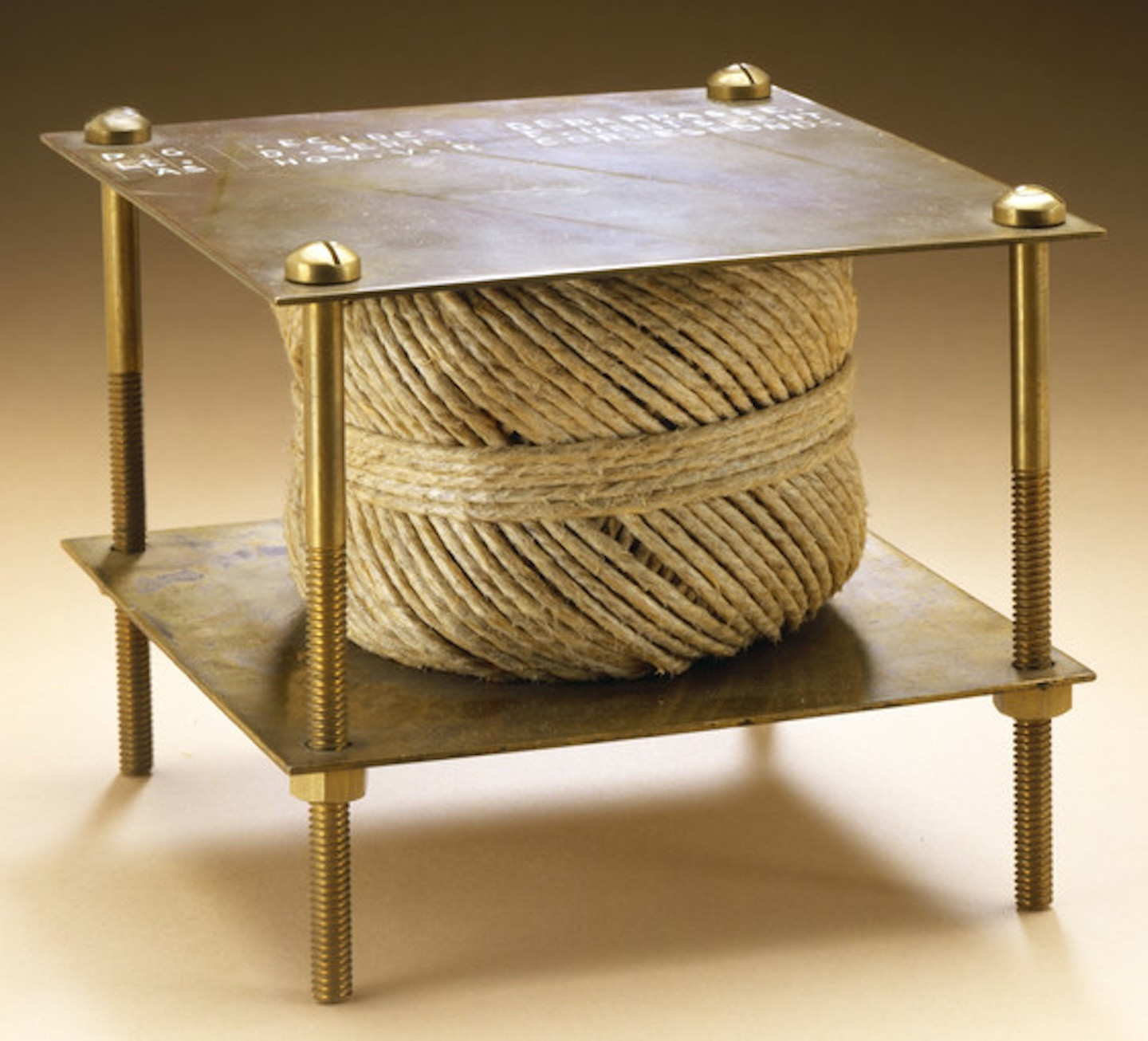 Marcel Duchamp. *With Hidden Noise*. 1916. Ball of twine between two brass plates, joined by four long screws, containing unknown object added by Walter Arensberg, 5 × 5 × 5 1/8" (12.7 × 12.7 × 13 cm). Philadelphia Museum of Art: The Louise and Walter Arensberg Collection, 1950