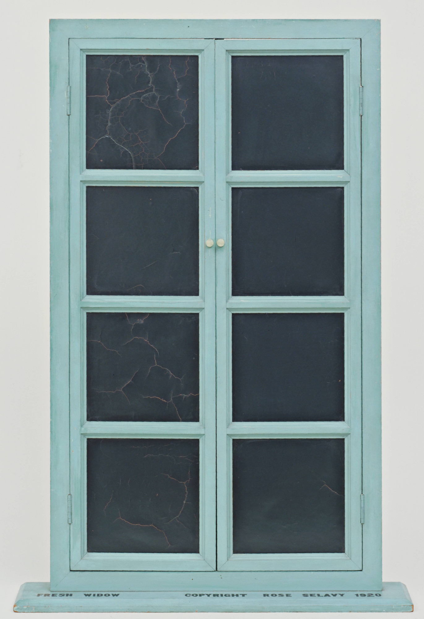 Marcel Duchamp. *Fresh Widow*. 1920. Miniature French window with panes of glass covered with black leather, painted wood frame, and plastic push pins, 30 1/2 x 17 5/8" (77.5 x 44.8 cm), on wood sill 3/4 x 21 x 4" (1.9 x 53.4 x 10.2 cm). The Museum of Modern Art, New York. Katherine S. Dreier Bequest. © 2026 Artists Rights Society (ARS), New York / ADAGP, Paris / Estate of Marcel Duchamp