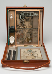 Marcel Duchamp. From or by Marcel Duchamp or Rrose Sélavy (Box in a Valise). 1935–41. Brown leather valise with handle containing sixty-nine miniature replicas and printed reproductions and one original, Virgin (No. 2), 1938, hand-colored collotype. Valise (closed): 16 × 14 3/4 × 4 1/4" (40.6 × 37.5 × 10.8 cm). Philadelphia Museum of Art: The Louise and Walter Arensberg Collection, 1950