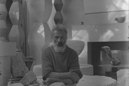 Constantin Brancusi. Self-portrait in the studio with Endless Columns I–IV, Fish (1930), Leda (1926). c. 1934. Glass negative, 5 7/8 × 3 15/16" (15 × 10 cm). Centre Pompidou, Paris, Musée national d’art moderne-Centre de création industrielle, Constantin Brancusi Bequest, 1957. PH 854. Digital image © CNAC/MNAM, Dist. RMN-Grand Palais/Art Resource, NY. © Succession Brancusi – All rights reserved (Adagp)