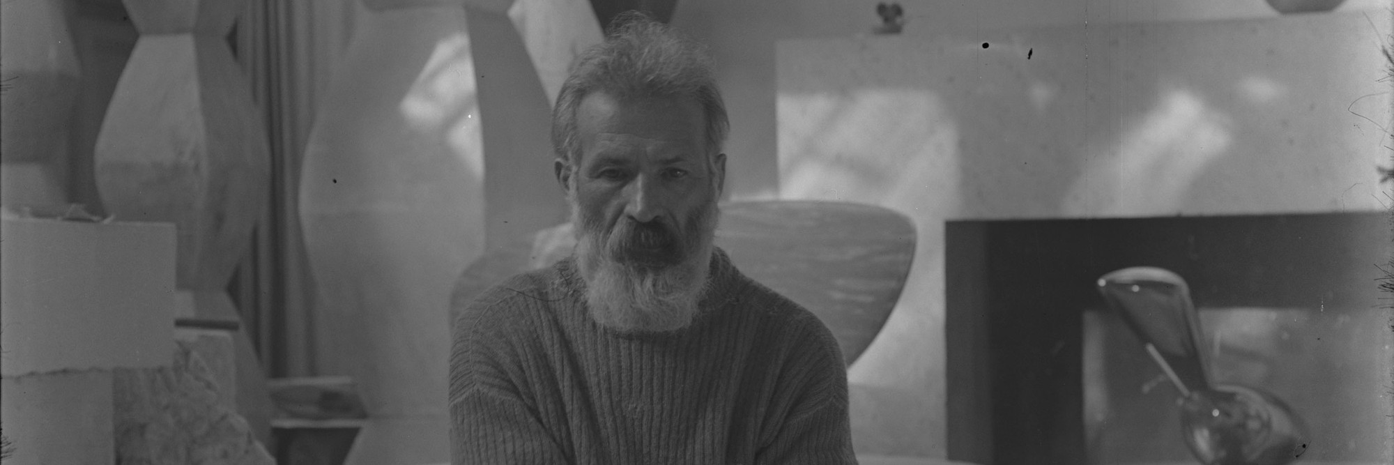 Constantin Brancusi. Self-portrait in the studio with Endless Columns I–IV, Fish (1930), Leda (1926). c. 1934. Glass negative, 5 7/8 × 3 15/16" (15 × 10 cm). Centre Pompidou, Paris, Musée national d’art moderne-Centre de création industrielle, Constantin Brancusi Bequest, 1957. PH 854. Digital image © CNAC/MNAM, Dist. RMN-Grand Palais/Art Resource, NY. © Succession Brancusi – All rights reserved (Adagp)