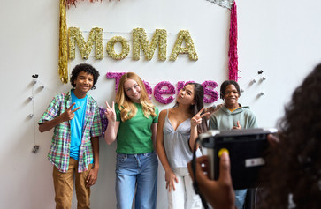 Open Art Space teens pose before a backdrop smiling at the camera. Photo: Alycia Kravitz