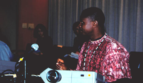 Simon Ikpakronyi, Principal Curator at the National Gallery of Art in Abuja, Nigeria, delivers a slide lecture about his home institution during the African Museum Professionals Workshop, 2002