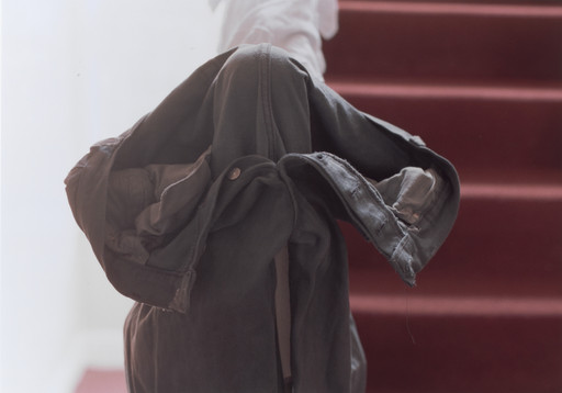 Wolfgang Tillmans. grey jeans over stair post. 1991