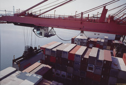 Allan Sekula. Hammerhead crane unloading forty-foot containers from Asian ports. American President Lines terminal. Los Angeles harbor. San Pedro, California from the series Fish Story. November 1992